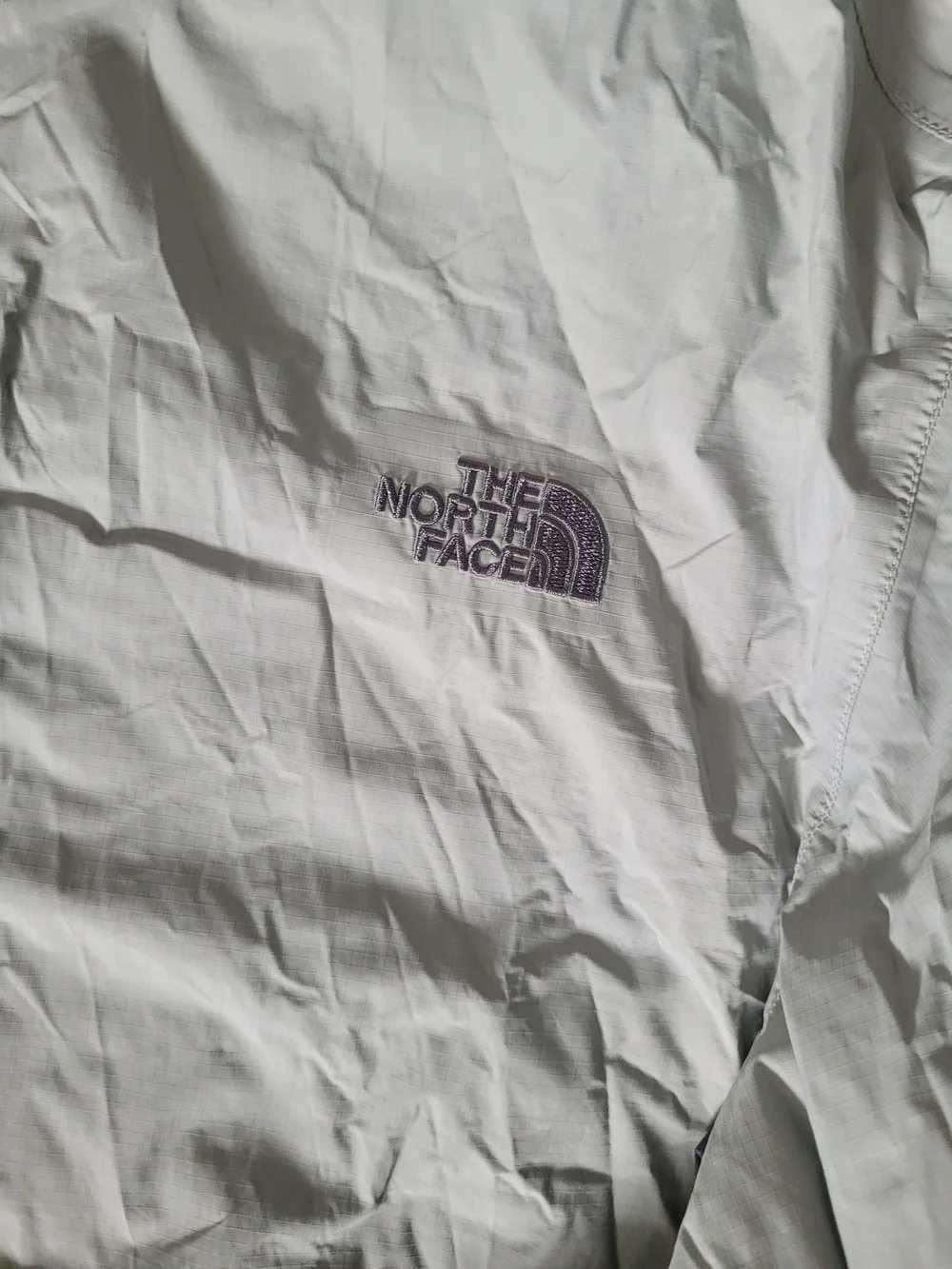 The North Face Light Gray Hooded Rain Jacket with Dark Gray Panels